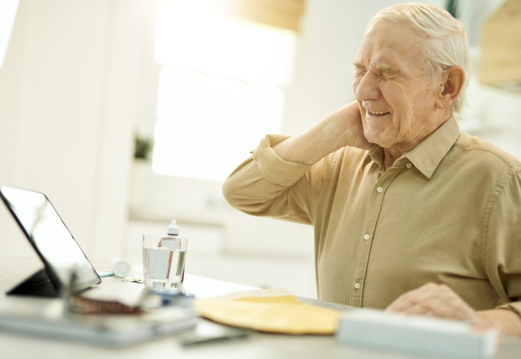 Senior citizen in pain getting medical advice online